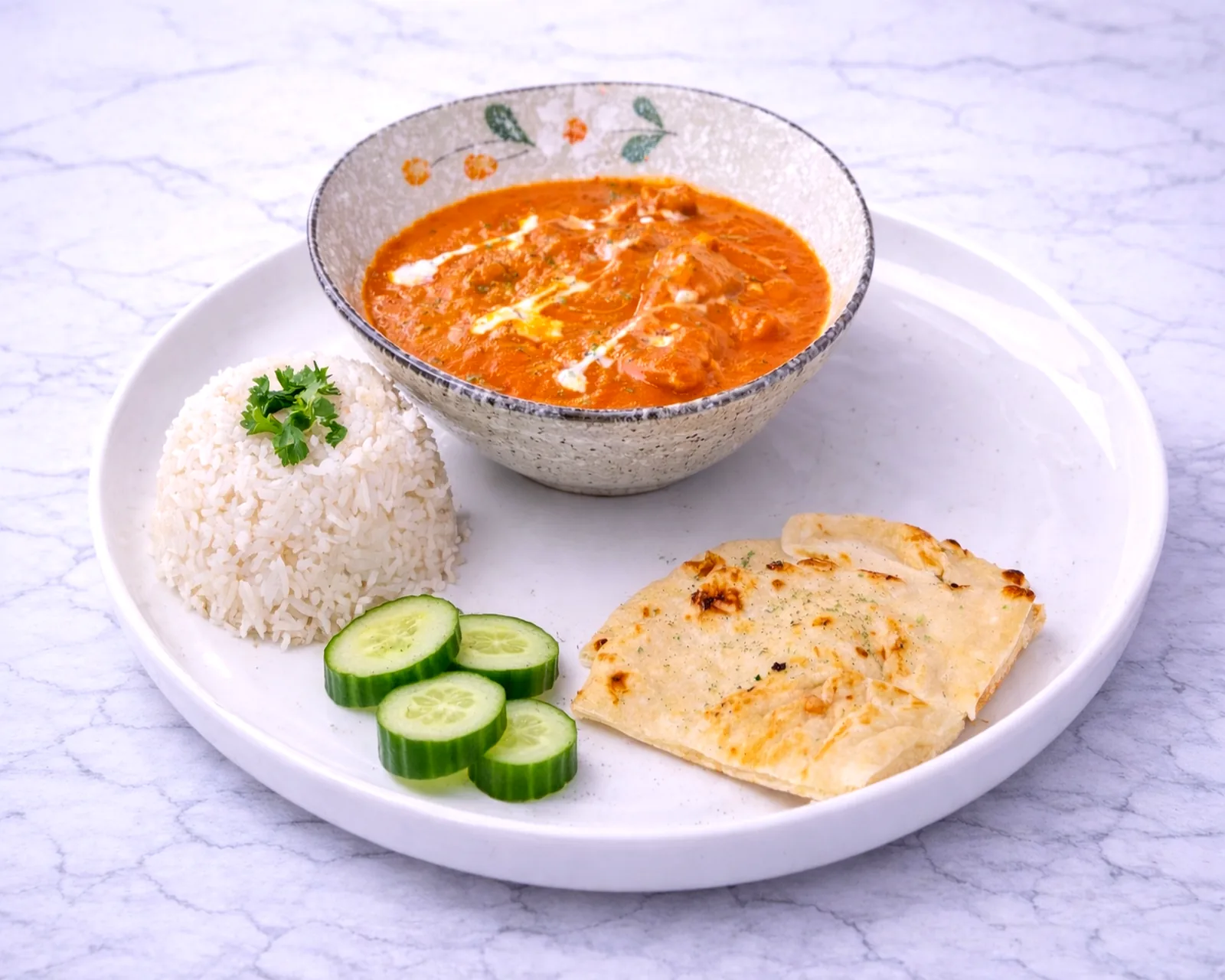 Butter chicken with rice and naan at ByWard Market Ottawa